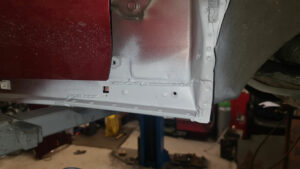 near side rear repair with first coat of grey Gravitex